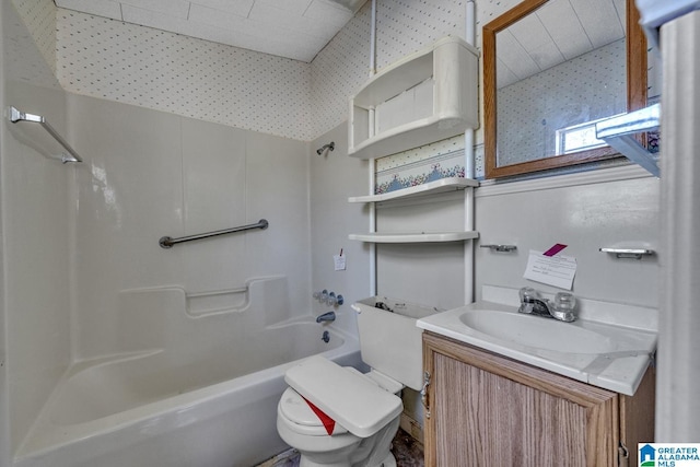 full bathroom featuring toilet,  shower combination, and vanity