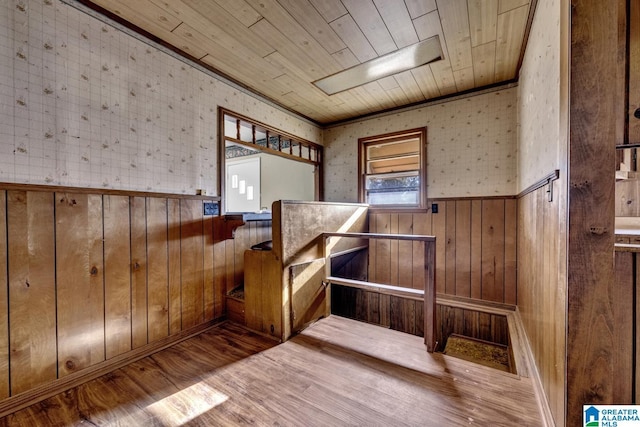 interior space featuring wood walls, wood finished floors, and wood ceiling