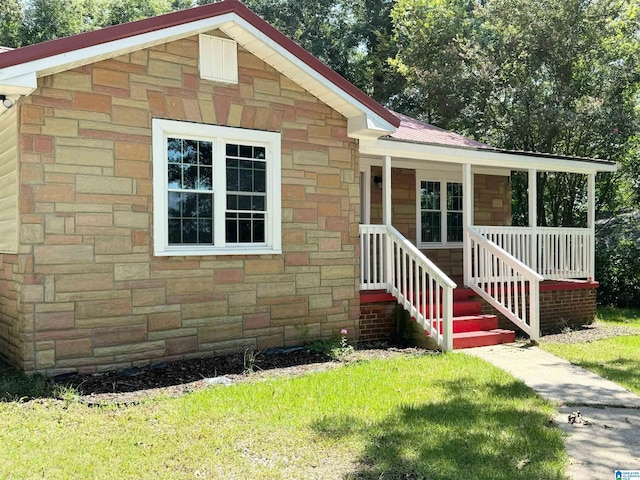 view of front of house featuring a front yard and a porch