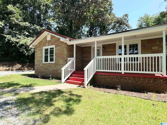 view of front of home featuring a front lawn and a porch