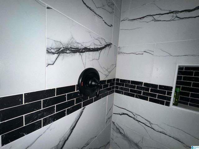 bathroom with a tile shower
