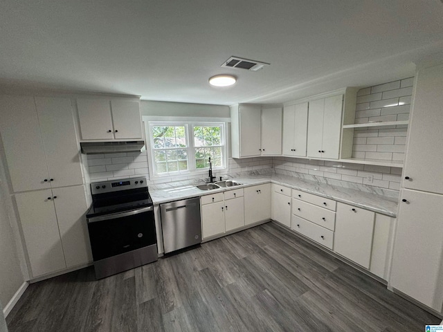 kitchen featuring a sink, open shelves, appliances with stainless steel finishes, under cabinet range hood, and dark wood-style flooring