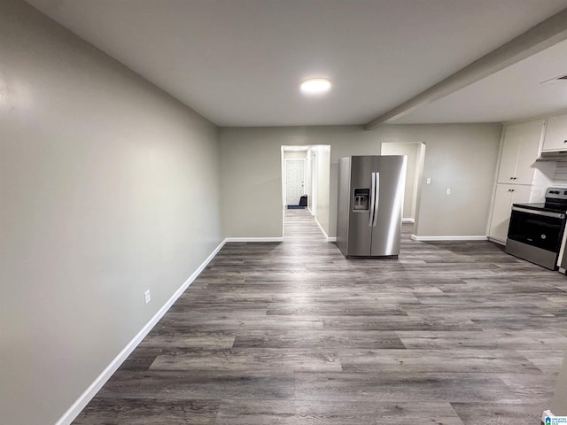 interior space featuring baseboards and dark wood-style floors