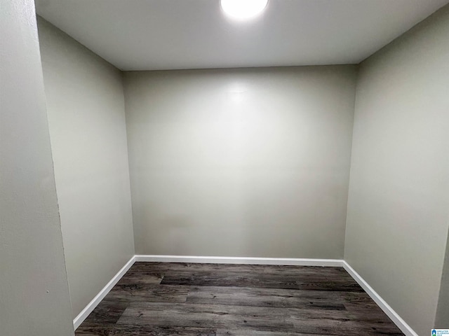 unfurnished room featuring dark wood-type flooring