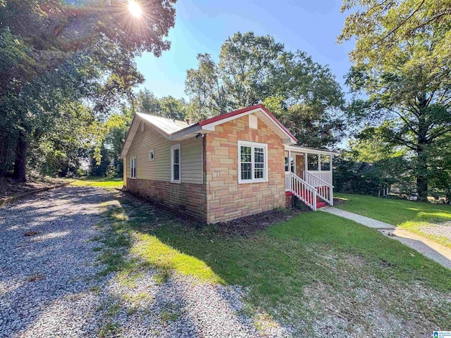 view of home's exterior with a yard