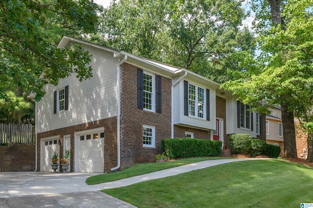 bi-level home with a garage and a front yard