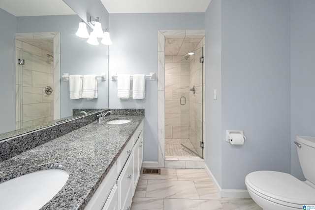 bathroom with tile patterned flooring, toilet, a shower with door, and vanity