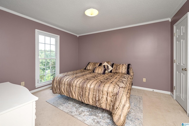 bedroom with multiple windows, a textured ceiling, and carpet flooring