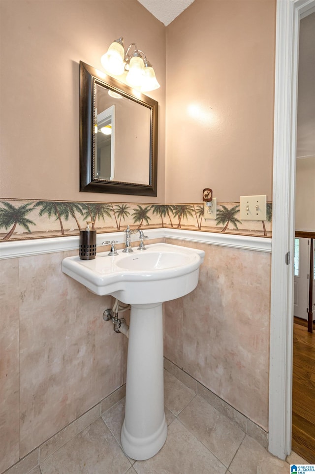 bathroom featuring tile patterned flooring and sink