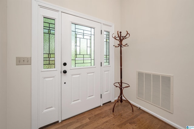 entryway with hardwood / wood-style flooring