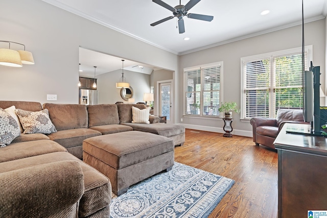 living area with crown molding, recessed lighting, ceiling fan, wood finished floors, and baseboards