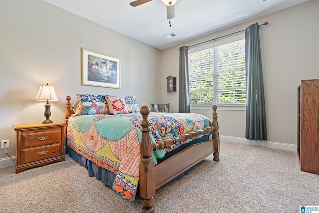 carpeted bedroom with baseboards, visible vents, and ceiling fan