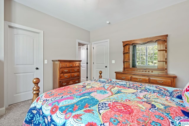 bedroom featuring light carpet