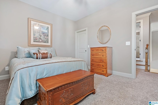 bedroom featuring carpet floors and baseboards