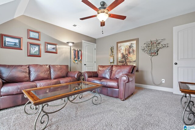 carpeted living area featuring a ceiling fan, lofted ceiling, visible vents, and baseboards