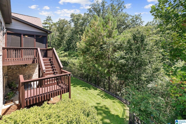 view of yard with a sunroom, a fenced backyard, stairs, and a deck