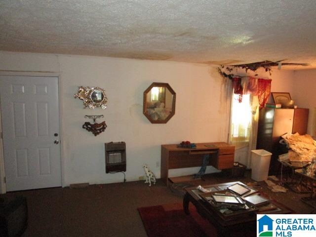 living room with a textured ceiling