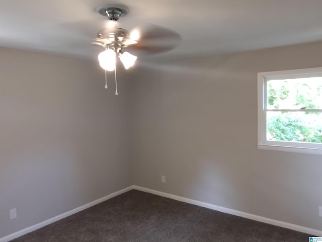 empty room with ceiling fan and carpet