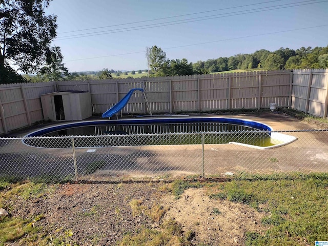 view of swimming pool featuring a water slide