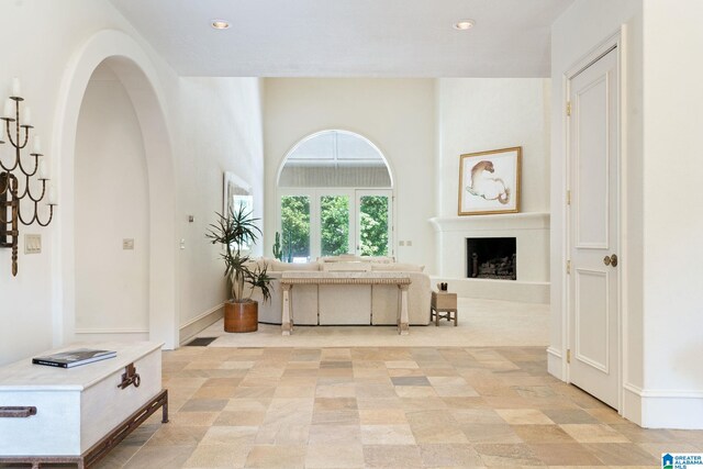 corridor with light tile patterned flooring