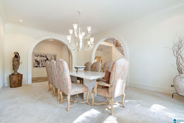 carpeted dining room with an inviting chandelier and ornamental molding