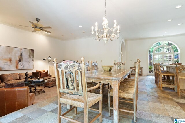 tiled dining space with ceiling fan with notable chandelier and crown molding