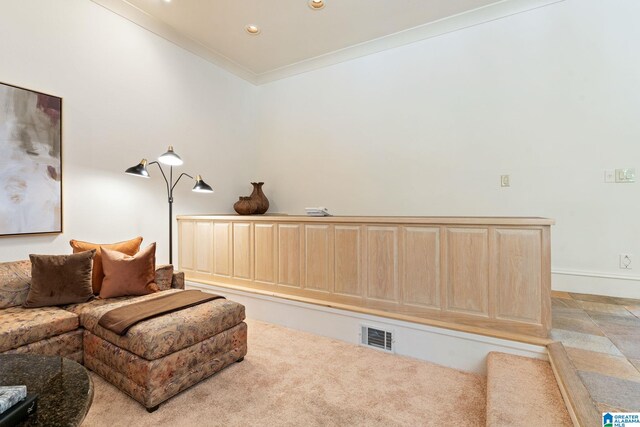 living room featuring light tile patterned floors and ornamental molding