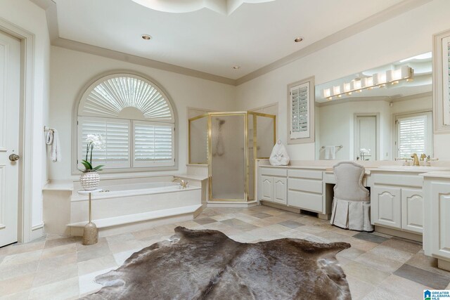 bathroom with shower with separate bathtub, vanity, and tile patterned floors