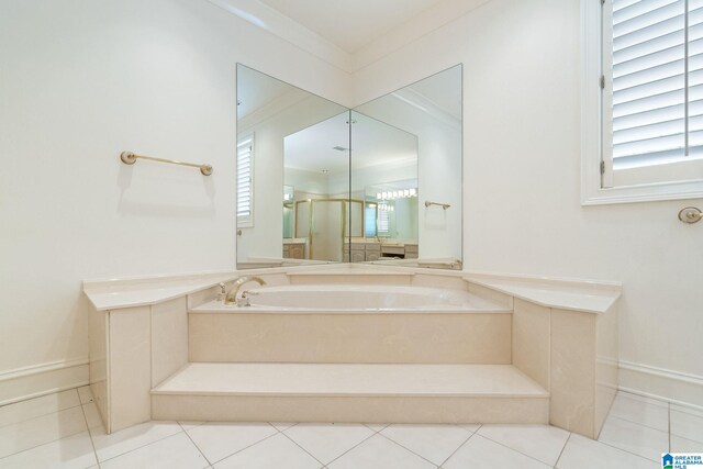 bathroom with a tub and tile patterned floors