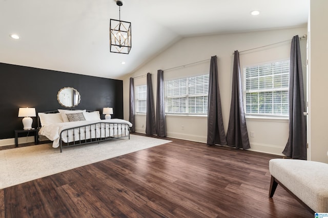 bedroom featuring vaulted ceiling and dark hardwood / wood-style floors