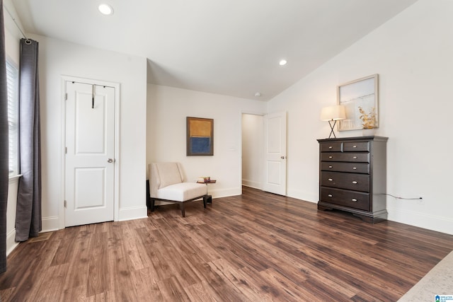 sitting room with lofted ceiling and dark hardwood / wood-style flooring