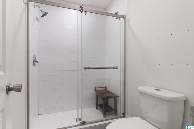 bathroom with toilet and walk in shower