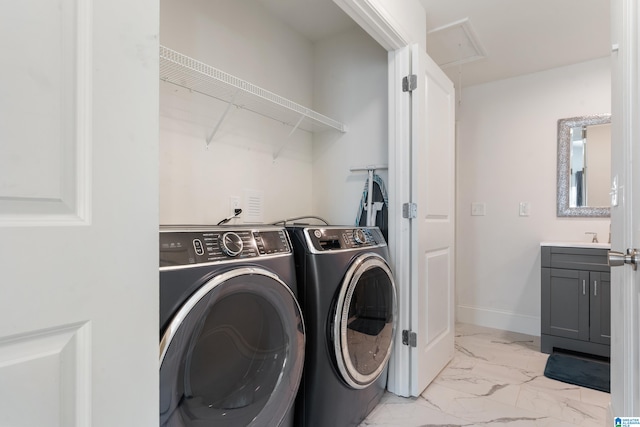 laundry room with separate washer and dryer and light tile patterned flooring