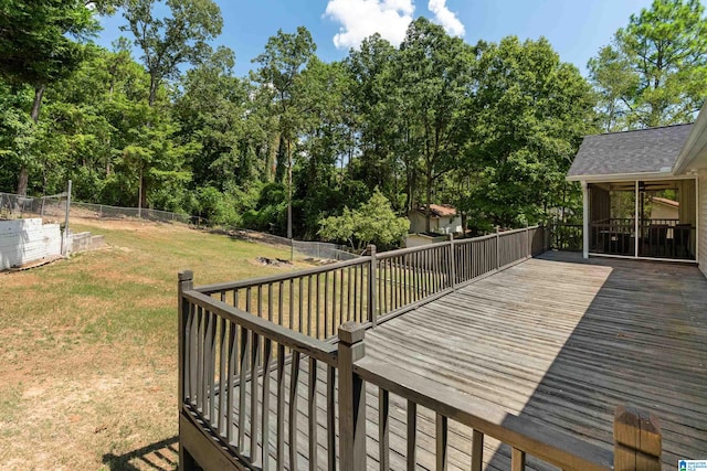 wooden deck with a lawn