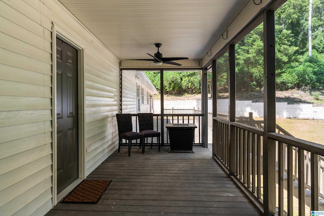 wooden deck with ceiling fan