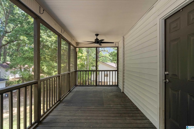 wooden deck featuring ceiling fan