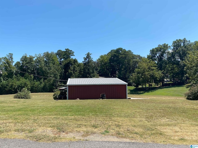 view of outdoor structure featuring a lawn