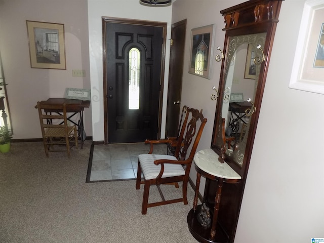 entryway with carpet floors and baseboards