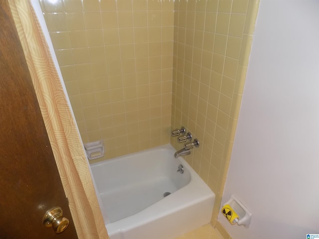 bathroom featuring shower / bath combo with shower curtain