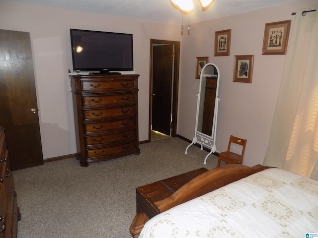 bedroom featuring carpet flooring and baseboards