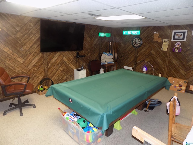 game room featuring wood walls, a drop ceiling, and pool table