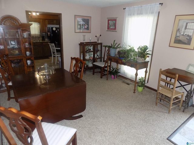 dining room featuring carpet and visible vents