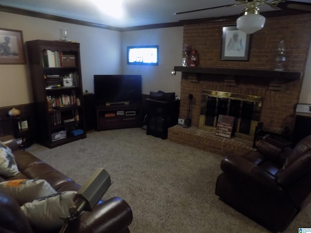 living area with light carpet, a brick fireplace, ceiling fan, and ornamental molding