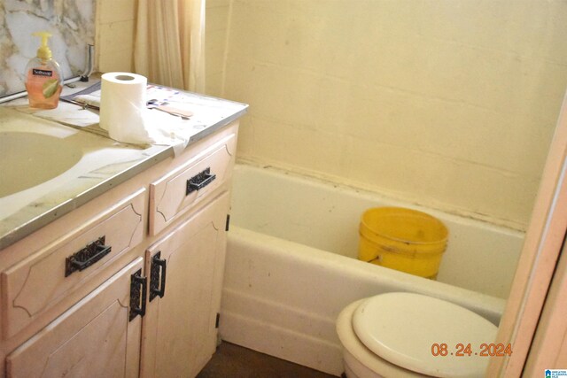 bathroom featuring toilet and vanity