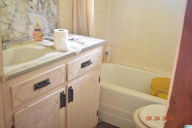 full bathroom featuring toilet, shower with separate bathtub, and vanity