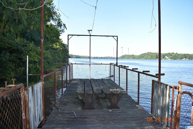 dock area featuring a water view