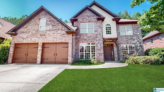 view of front facade with a front yard and a garage