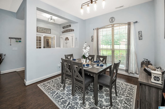 dining area featuring dark hardwood / wood-style floors