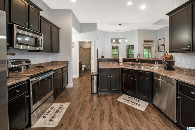 kitchen featuring dark wood-type flooring and stainless steel appliances