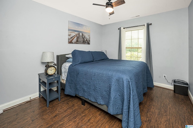 bedroom featuring dark wood-type flooring and ceiling fan